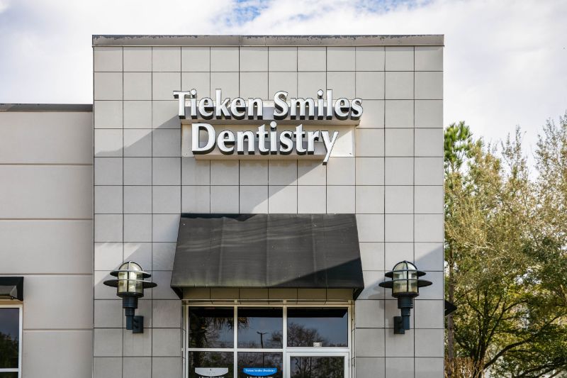 Tieken Smiles Dentistry sign above entrance