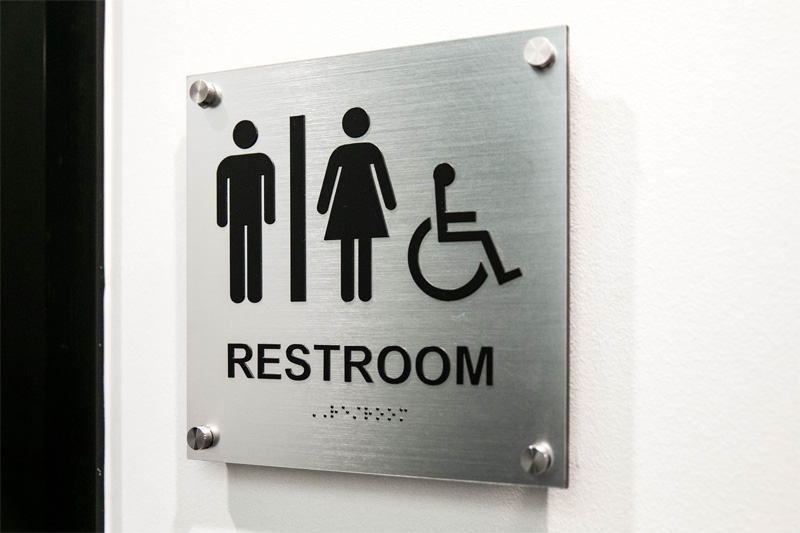 close up of restroom sign